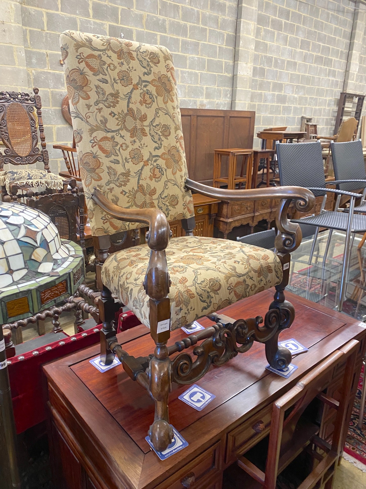 A reproduction Jacobean style mahogany upholstered elbow chair, width 64cm, depth 51cm, height 170cm